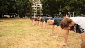 Students holding a plank