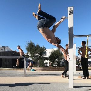 Nathan Leith demonstrates calisthenics chamber hold at Bondi