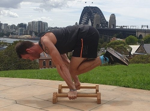 Nathan performing a tuck planche push-up